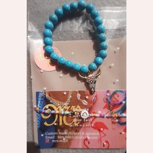 Armband gemaakt door Miranda van der Sman Kralen Armband met bedel koeienschedel